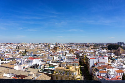 High angle view of townscape against blue sky