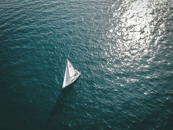 High angle view of sailboat sailing in sea