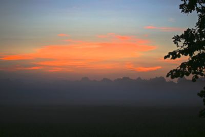 Scenic view of silhouette landscape against sky during sunset