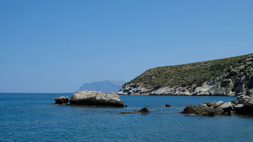 Scenic view of sea against clear blue sky