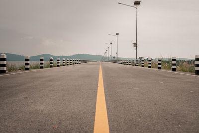 Empty road against sky