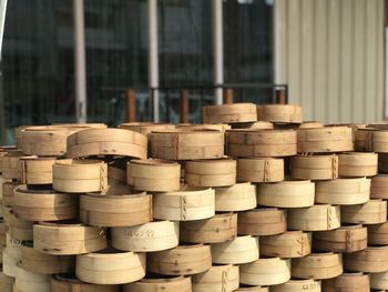 Stack of bamboo steamer in building