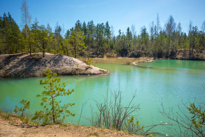 A beautiful spring scenery at the small lake with turquoise blue water.