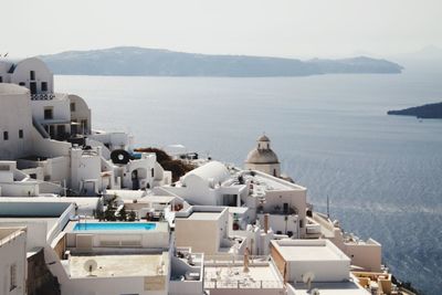 High angle view of buildings against sea