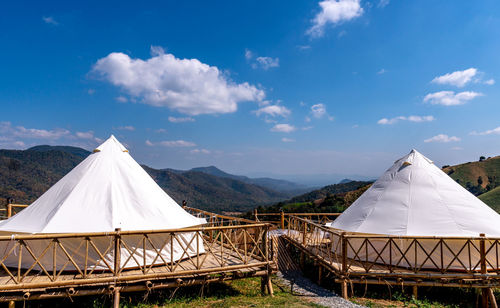 Built structure on land against blue sky