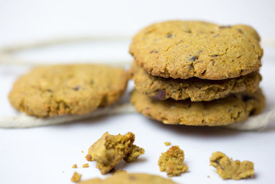 Close-up of cookies served over white background