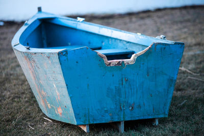 Abandoned boat on field