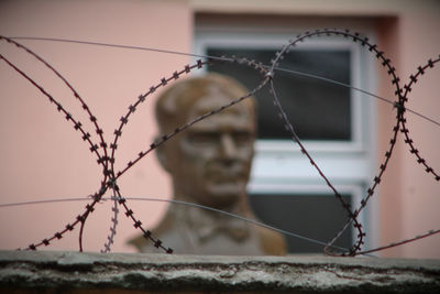 Close-up of barbed wire fence