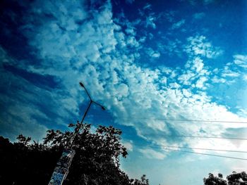 Low angle view of silhouette tree against sky