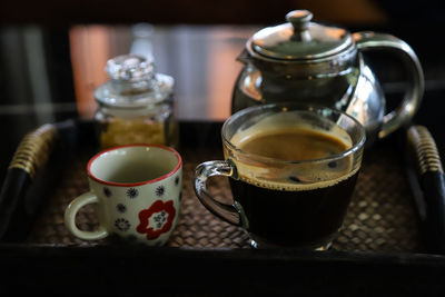 Close-up of coffee cup on table