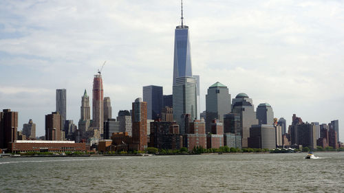 Modern buildings in city against sky