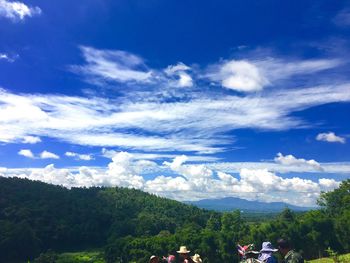 Scenic view of mountains against cloudy sky