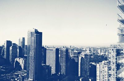 Skyscrapers in city against clear sky