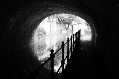 Silhouette people in tunnel