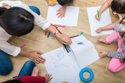 High angle view of people on table