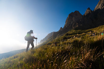 Rear view of man standing on mountain