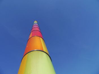 Low angle view of rainbow against clear blue sky