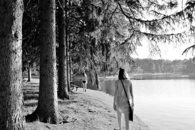 Rear view of man and woman in forest