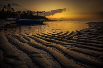 Scenic view of sea at sunset