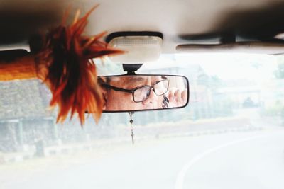 Close-up of eyeglasses on glass window