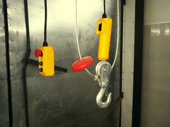 Close-up of yellow hanging from door