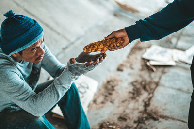 High angle view of man holding ice cream