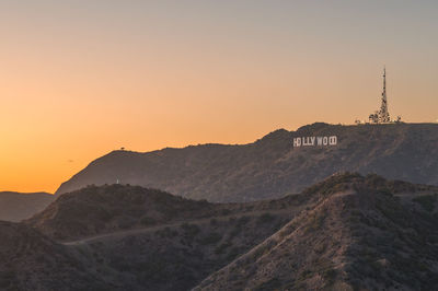 Scenic view of mountains against clear sky during sunset