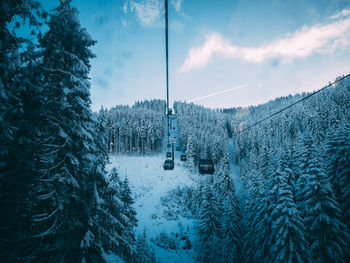 Snow covered land against sky