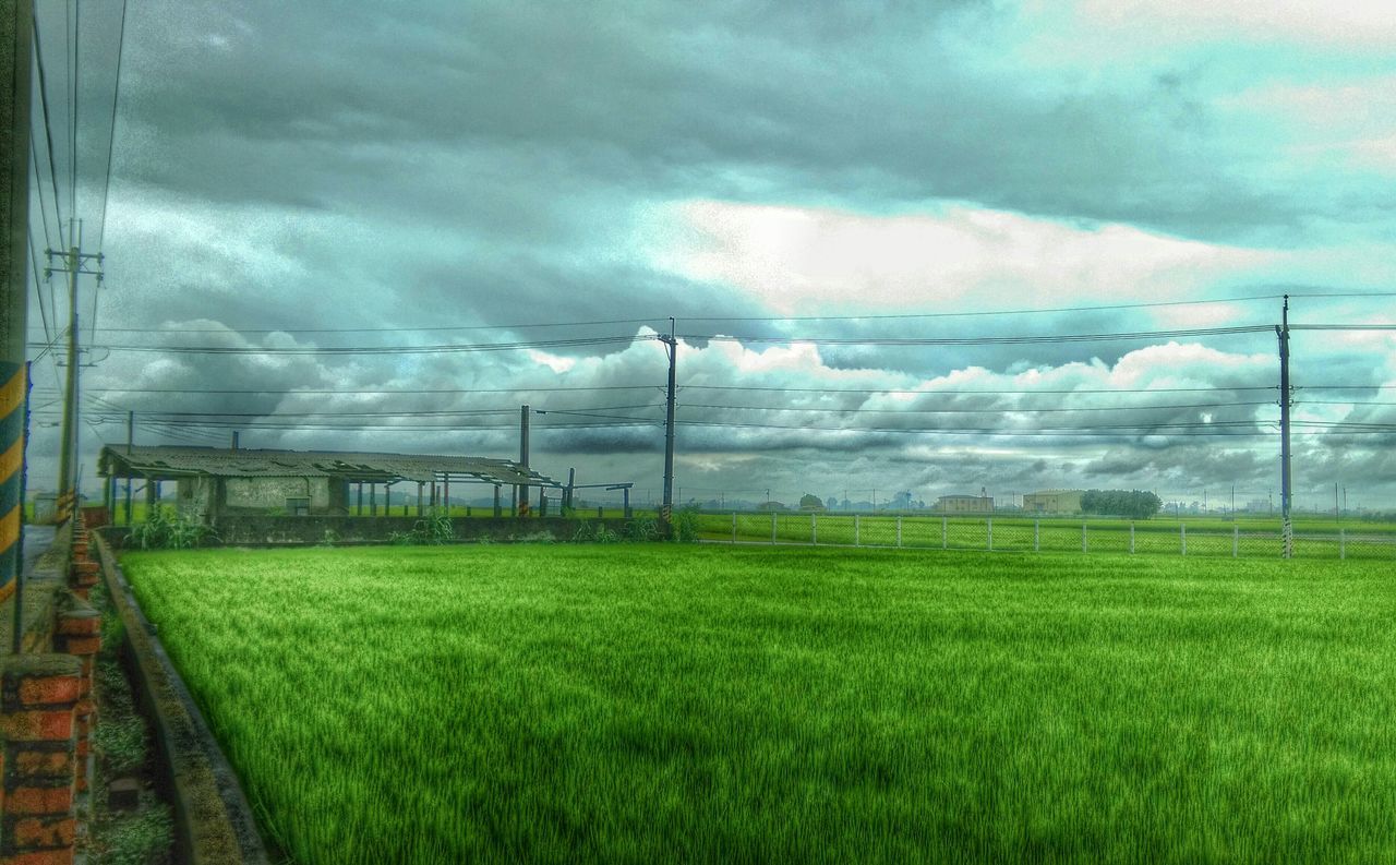 sky, cloud - sky, field, cloudy, grass, landscape, weather, electricity pylon, power line, nature, tranquil scene, grassy, tranquility, cloud, green color, overcast, rural scene, scenics, beauty in nature, electricity