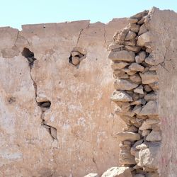 Low angle view of weathered wall