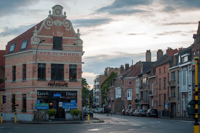 Street amidst buildings in city against sky