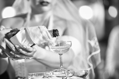 Woman pouring champagne