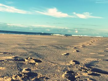 Scenic view of beach against sky