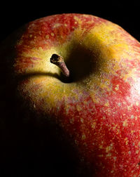 Close-up of apple on black background