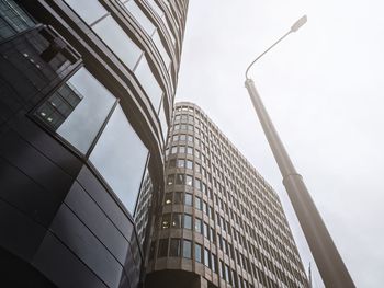 Low angle view of modern buildings against sky