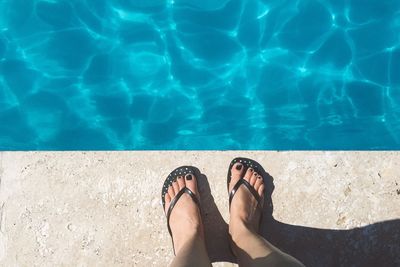 Low section of woman in swimming pool