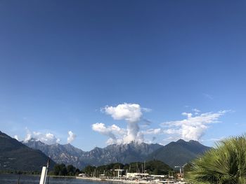 Scenic view of mountains against blue sky