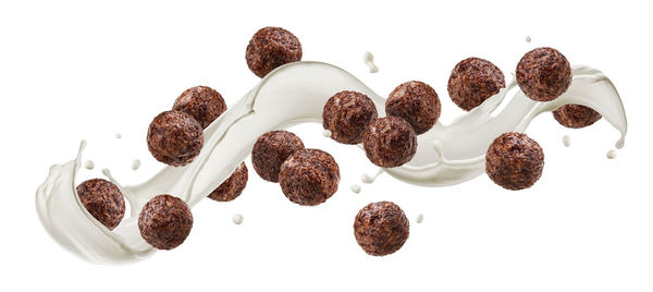 High angle view of coffee beans against white background