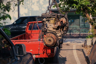 Abandoned car on street in city