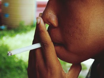 Close-up of man smoking cigarette