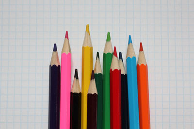 Close-up of colored pencils against white background