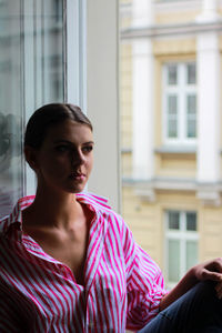 Woman sitting by the window