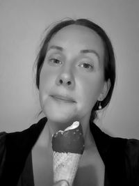 Close-up portrait of a woman drinking coffee