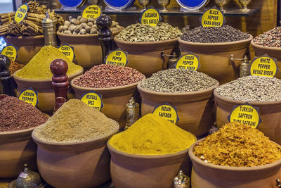 Various spices with tags at market stall in spice bazaar