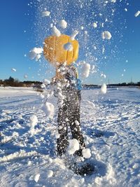 High angle view of throwing the snow