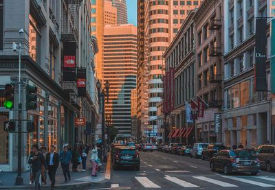 People on city street amidst buildings