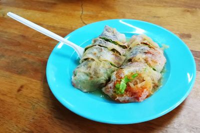 High angle view of meat in plate on table