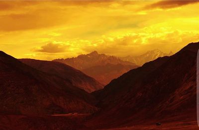 Scenic view of mountains at sunset