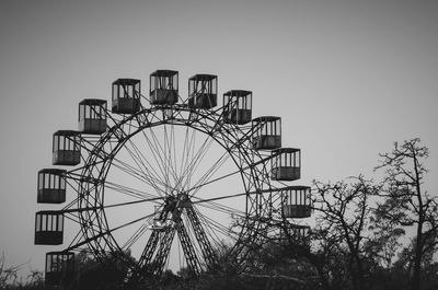 Low angle view of ferris wheel against sky