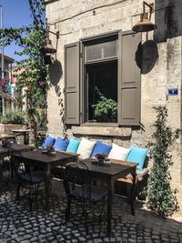 Chairs and table in front of house